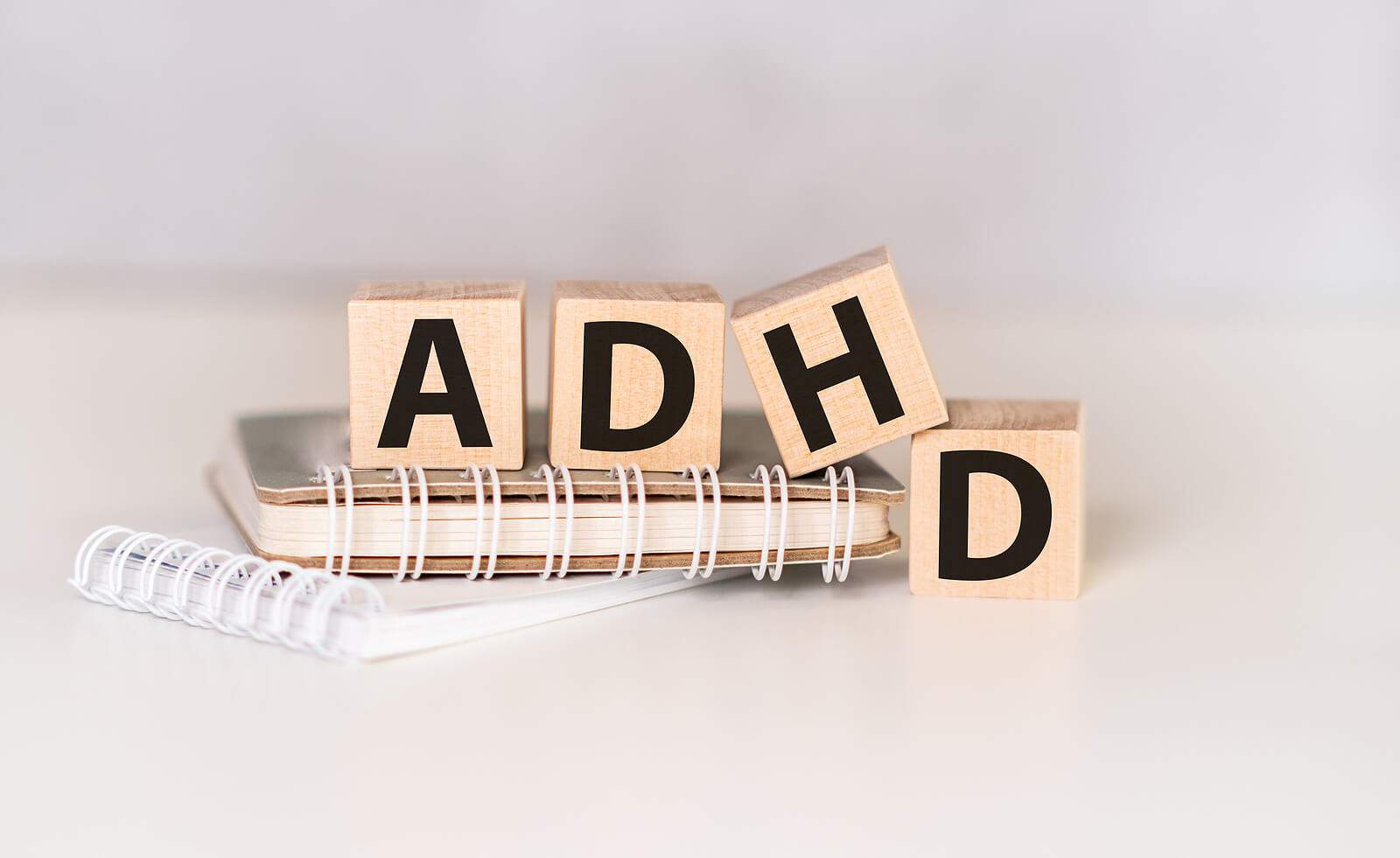 ADHD letters on wooden blocks. Neurodevelopmental screenings in Campbell, CA can support your child in many ways. Learn more from our caring psychologists here.