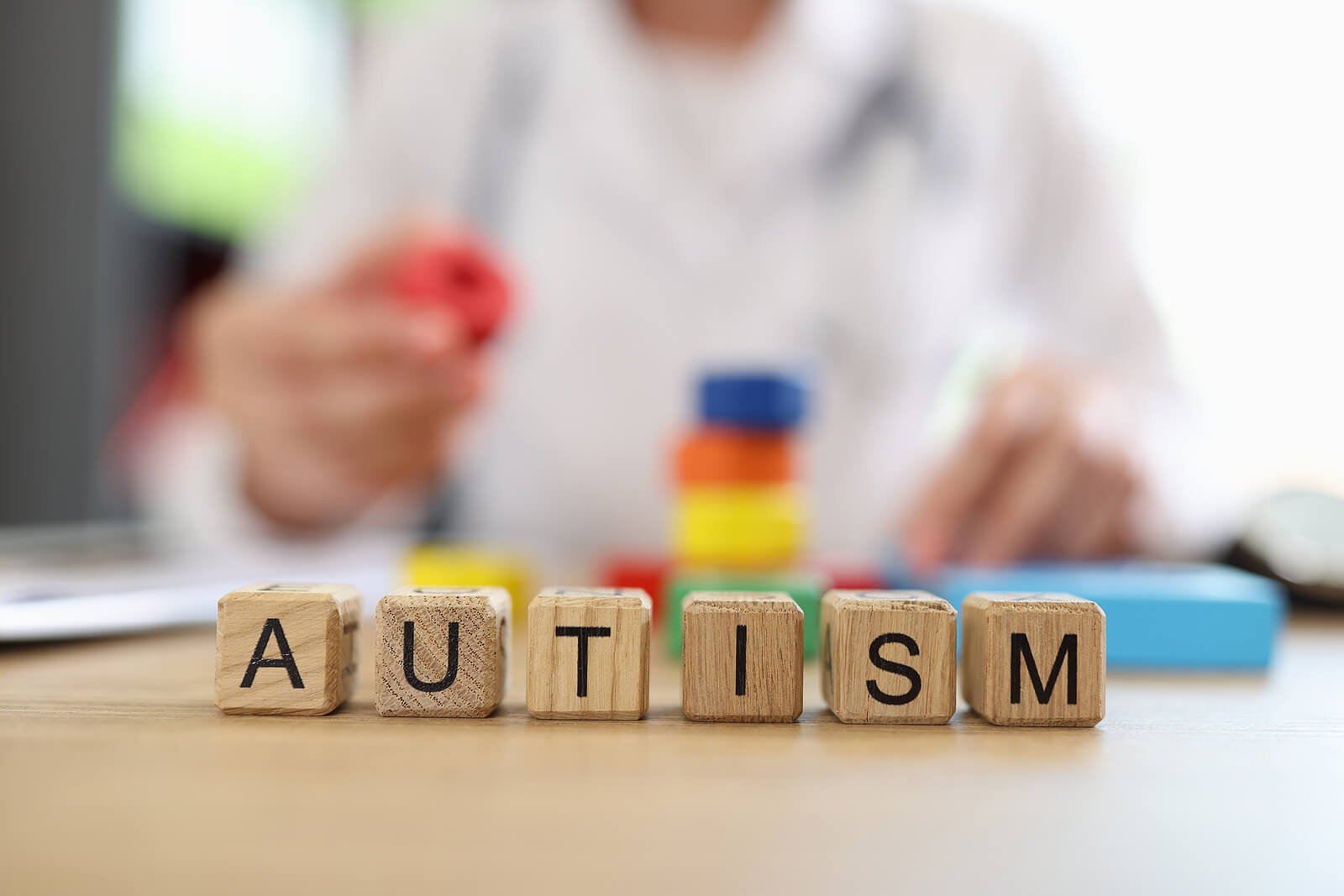 Autism spelled out on wooden blocks. If you are looking for a neurodevelopmental or autism testing, contact us! Our psychiatrists are here for you.