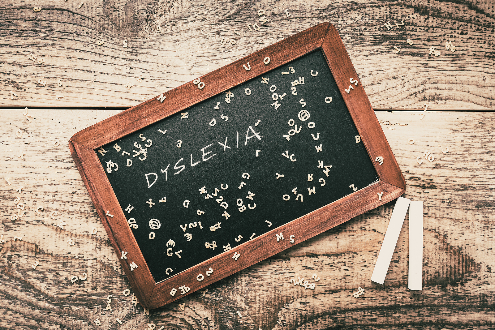 Dyslexia wrote on a chalkboard. Dyslexia testing in Campbell, CA can be your child's support. Learn more about neurodevelopmental screenings in San Francisco, CA.