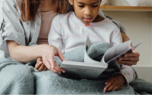 A young boy and woman reading a book together. Dyslexia testing in San Francisco, CA is here to better support your child! Learn more from our neurodiversity affirming psychologists here. 