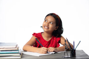 A young girl focusing on school work. Representing how dyslexia testing in Berkeley, CA can be beneficial for your child! Contact us today to learn more.